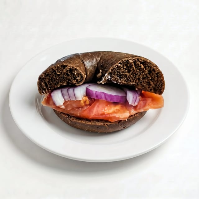 Bagel with Fresh Lox, Cream Cheese, Tomato and Onions.